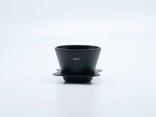 OREA 01 Obsidian Steel conical dripper with matte black finish and petal-shaped drip tray