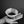 Sibarist FLAT flat-bottom coffee filter held in hand showing smooth ungrooved design