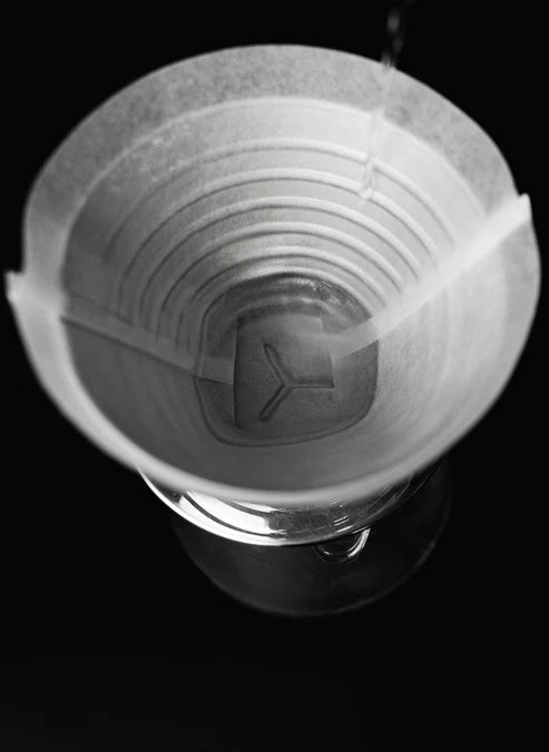 Sibarist FLAT 2 filter installed in metal dripper with water pouring for zero-bypass extraction